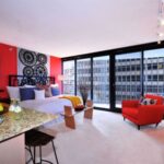 Glamorous studio apartment design ideas with wall art and mirror