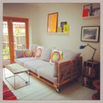 Living room seating arrangement with wooden pallet couch