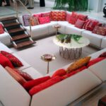 Living room seating arrangements with red and white sunken sitting area