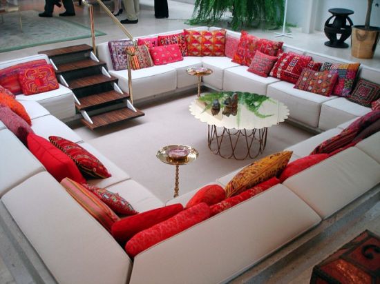 Living room seating arrangements with red and white sunken sitting area