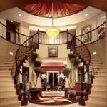 Elegant Double Winding Stairs Into Large Round Foyer