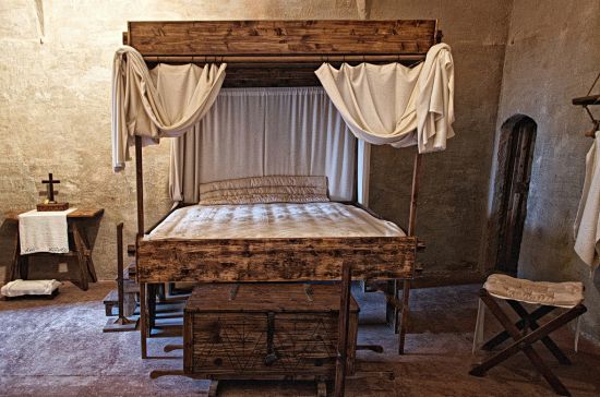 Medieval Bedroom Decked Up With Bed Stool Chest And Table Medieval Bedroom