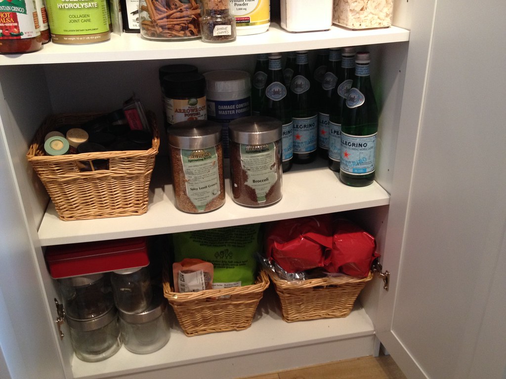 Organized cabinet shelves with baskets
